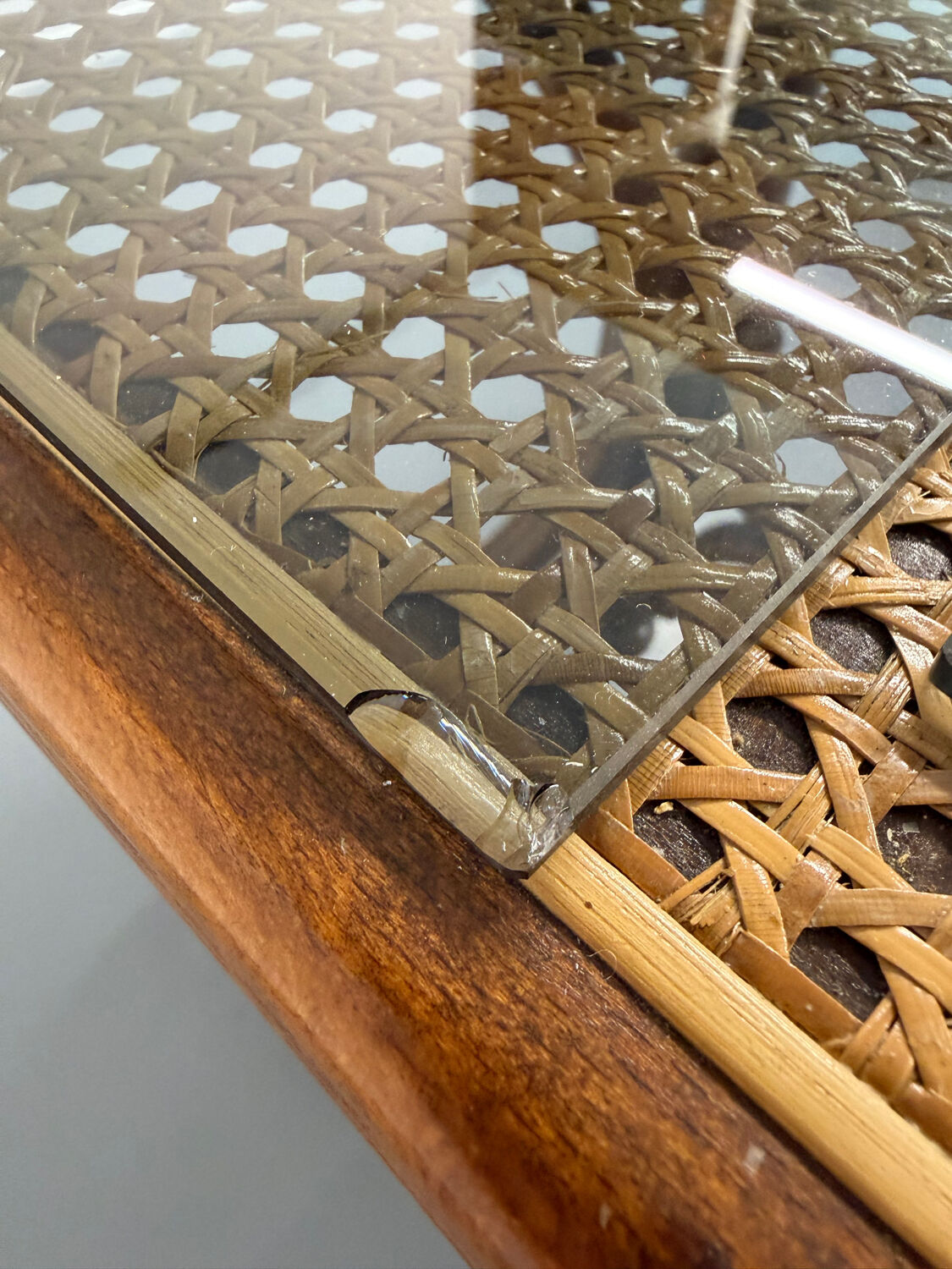 Vintage dining table with a cane top by Mundus from the 1970s.