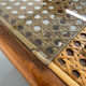 Vintage dining table with a cane top by Mundus from the 1970s.