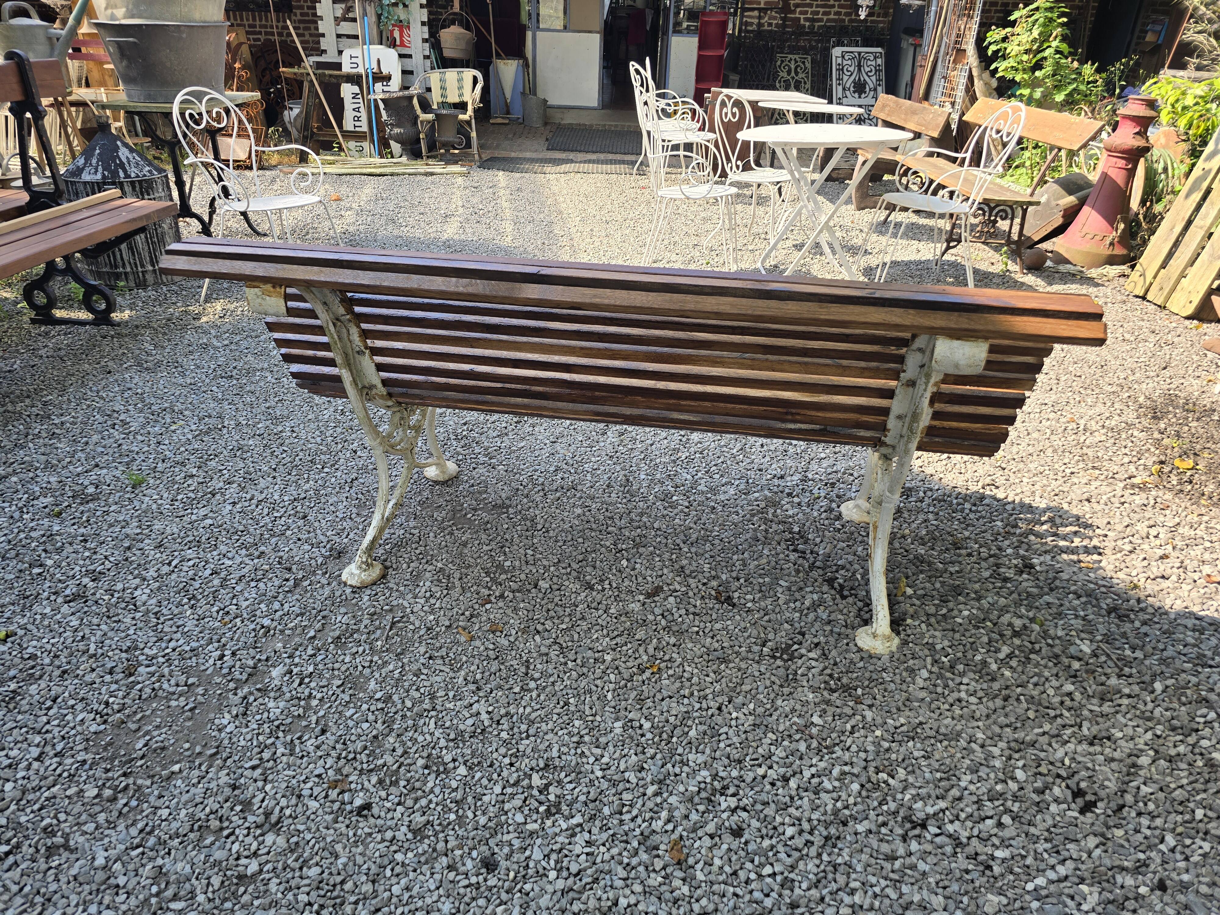 Garden bench with cast iron legs and oak slats