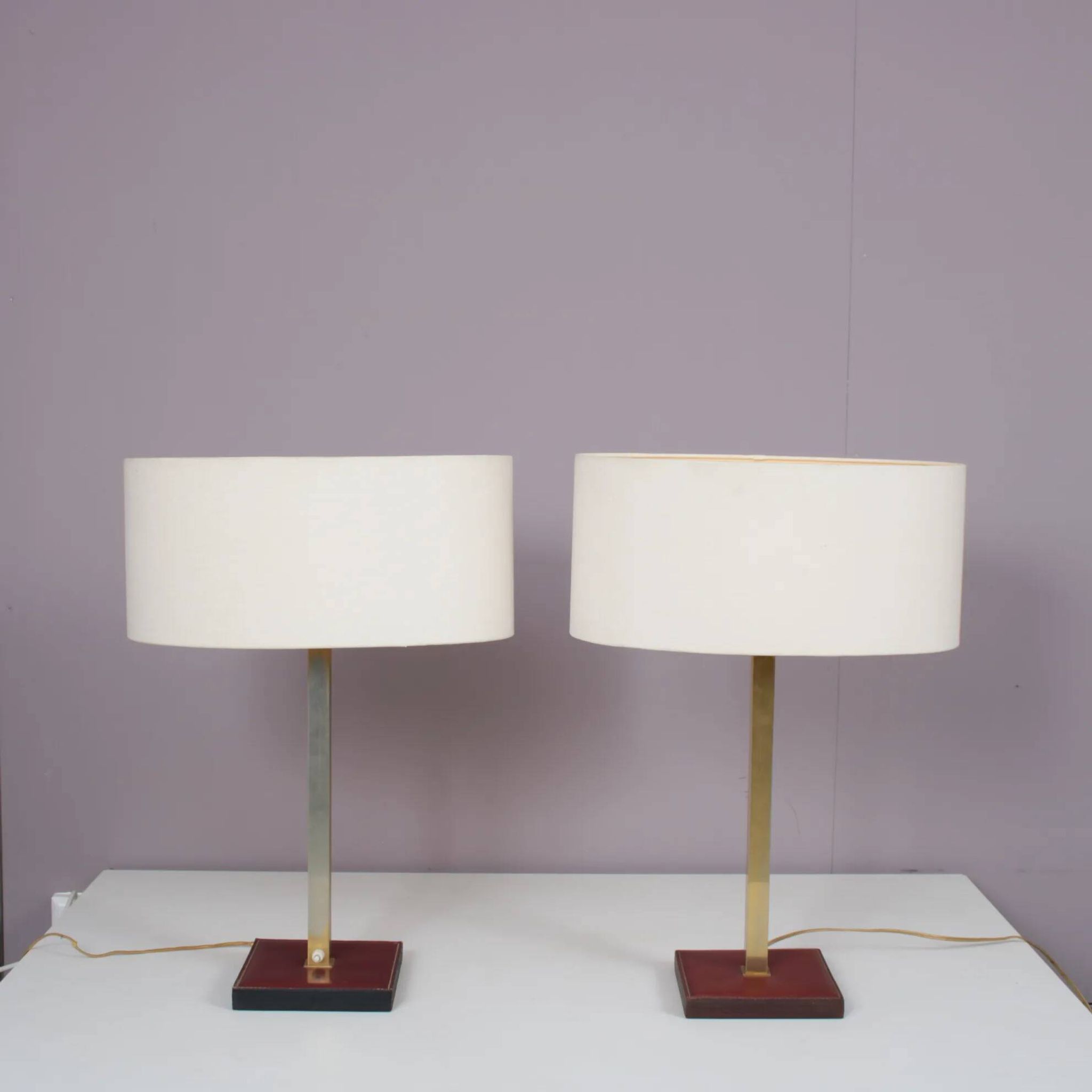 Pair of leather and brass table lamps from the 1960s, originating from Belgium.