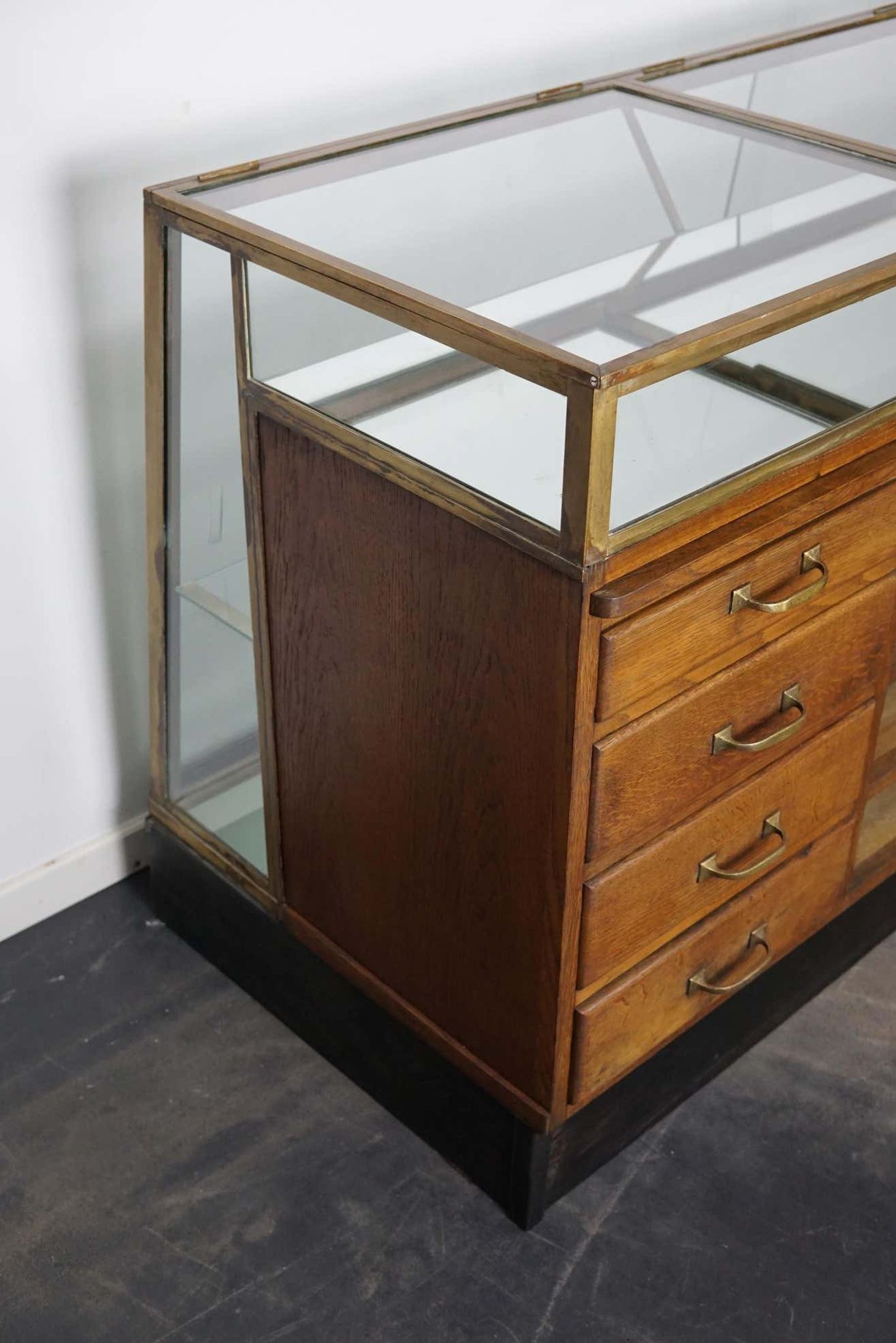 Counter or shop window in oak glass and brass France around 1920