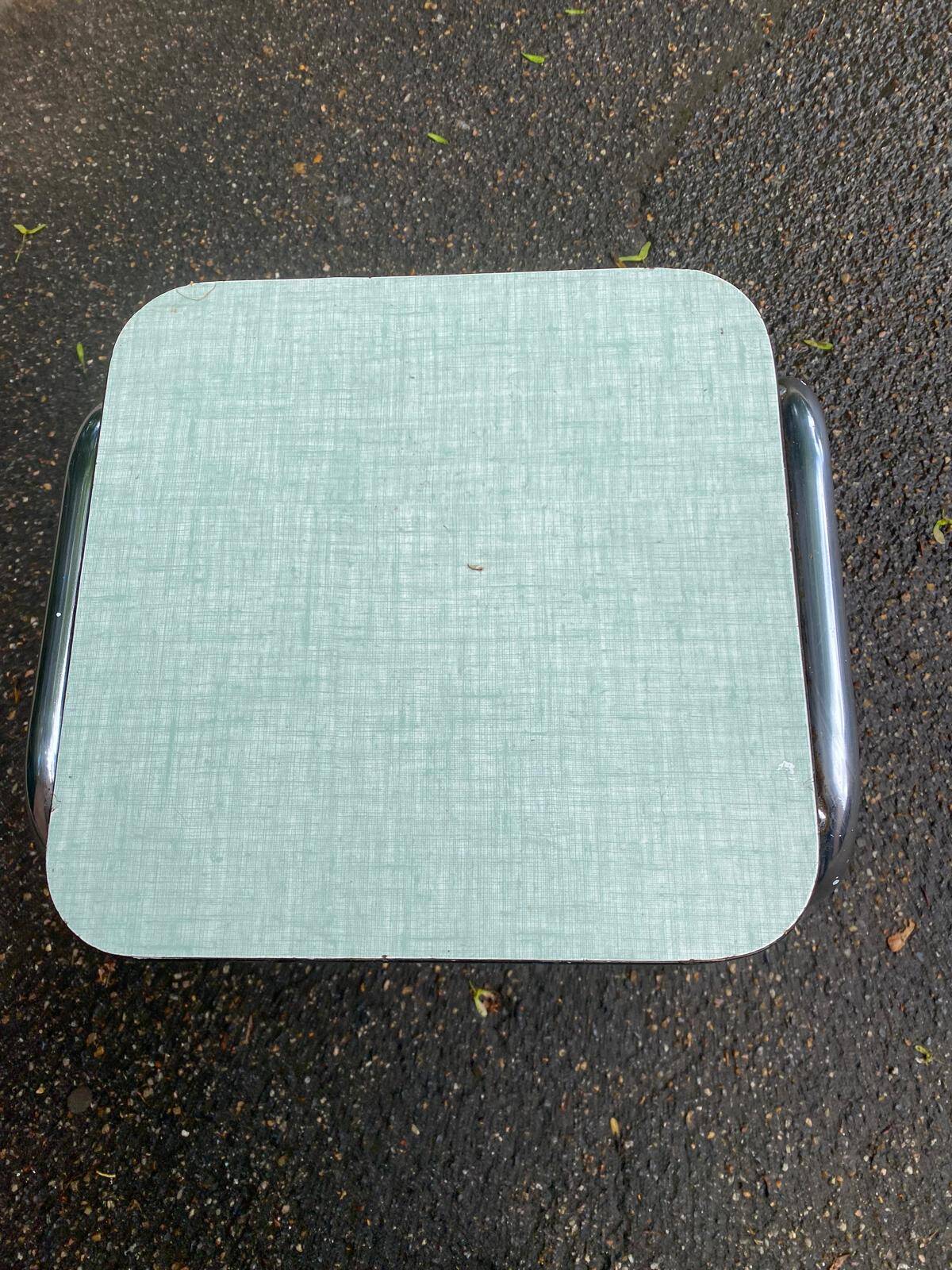 Folding stool in chrome steel, blue formica and solid wood.