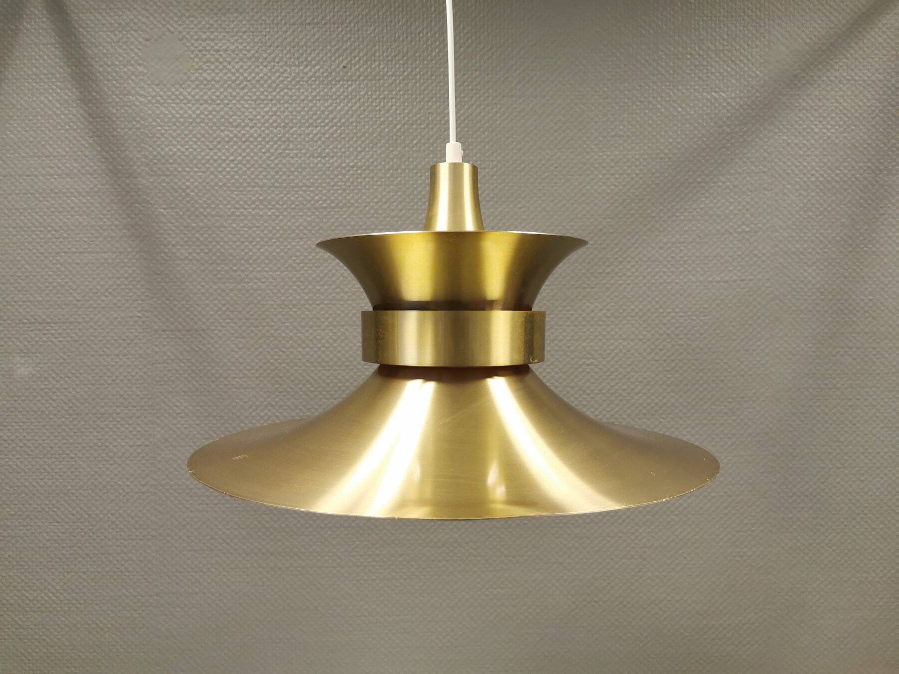 Large hanging lamp, made of brass-coloured aluminium with red and white contrast lacquer inside.