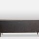 Sideboard in wenge, raffia and lacquered metal. 1970s.