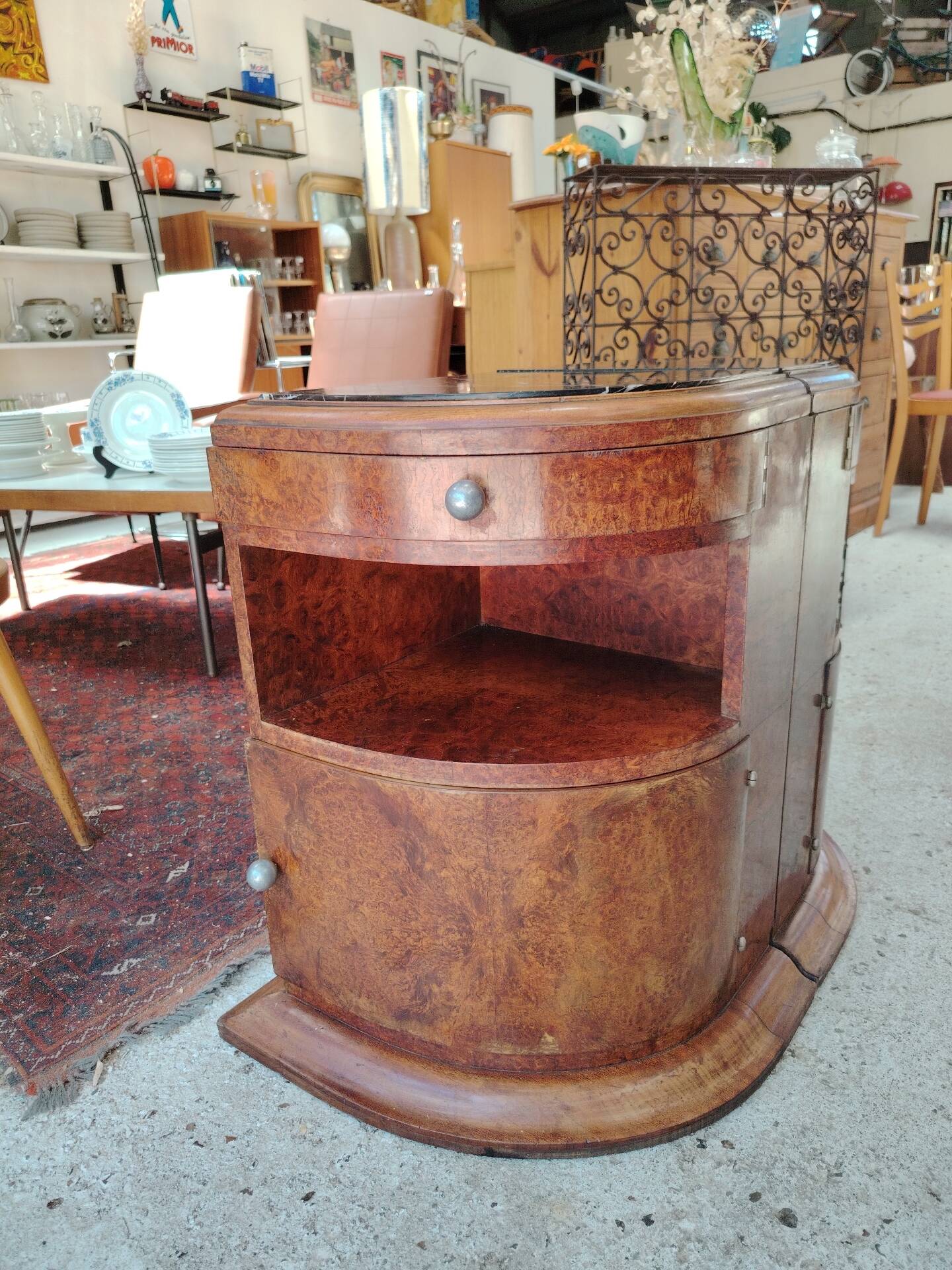 Pair of Art Deco half-moon bedside tables in walnut veneer and black marble.
