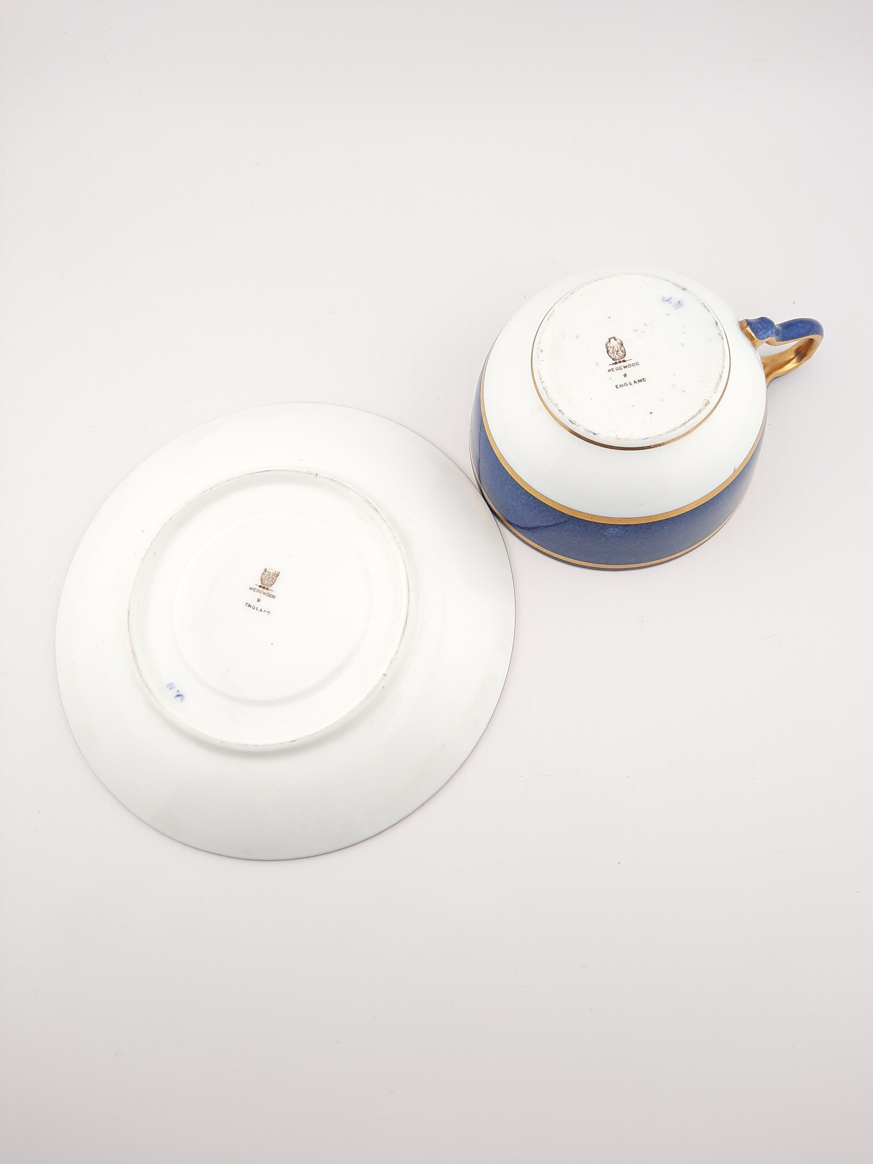 Antique Wedgwood teacup and saucer, bone china. Powder blue and gold English cup and saucer, 1900s