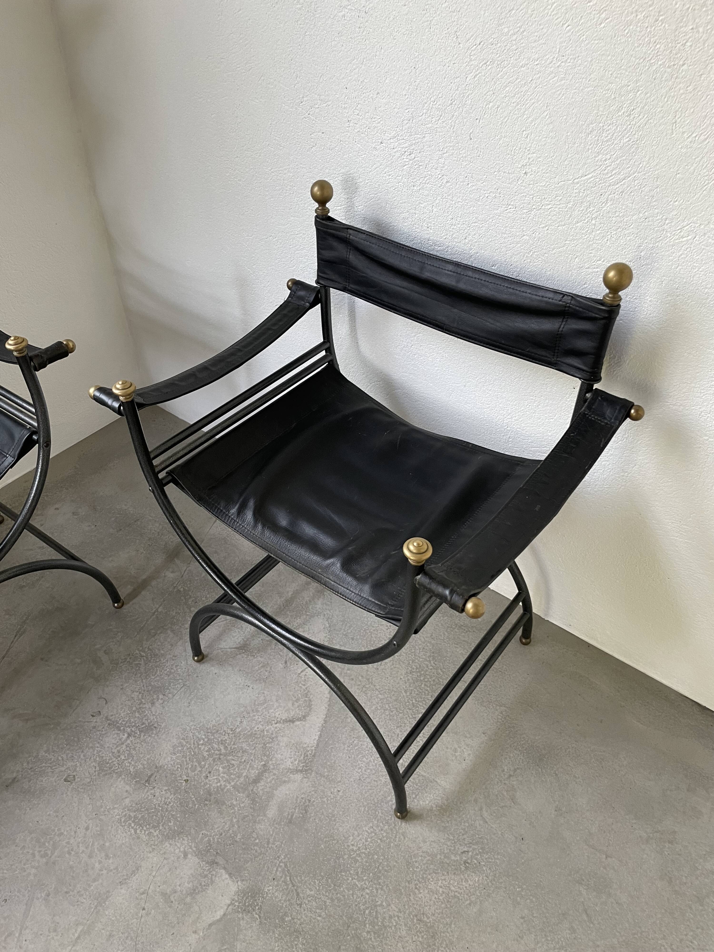 Pair of leather “curule” emperor armchairs