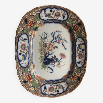 Large hollow dish in fine earthenware with Japanese decoration.