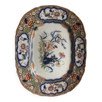 Large hollow dish in fine earthenware with Japanese decoration.