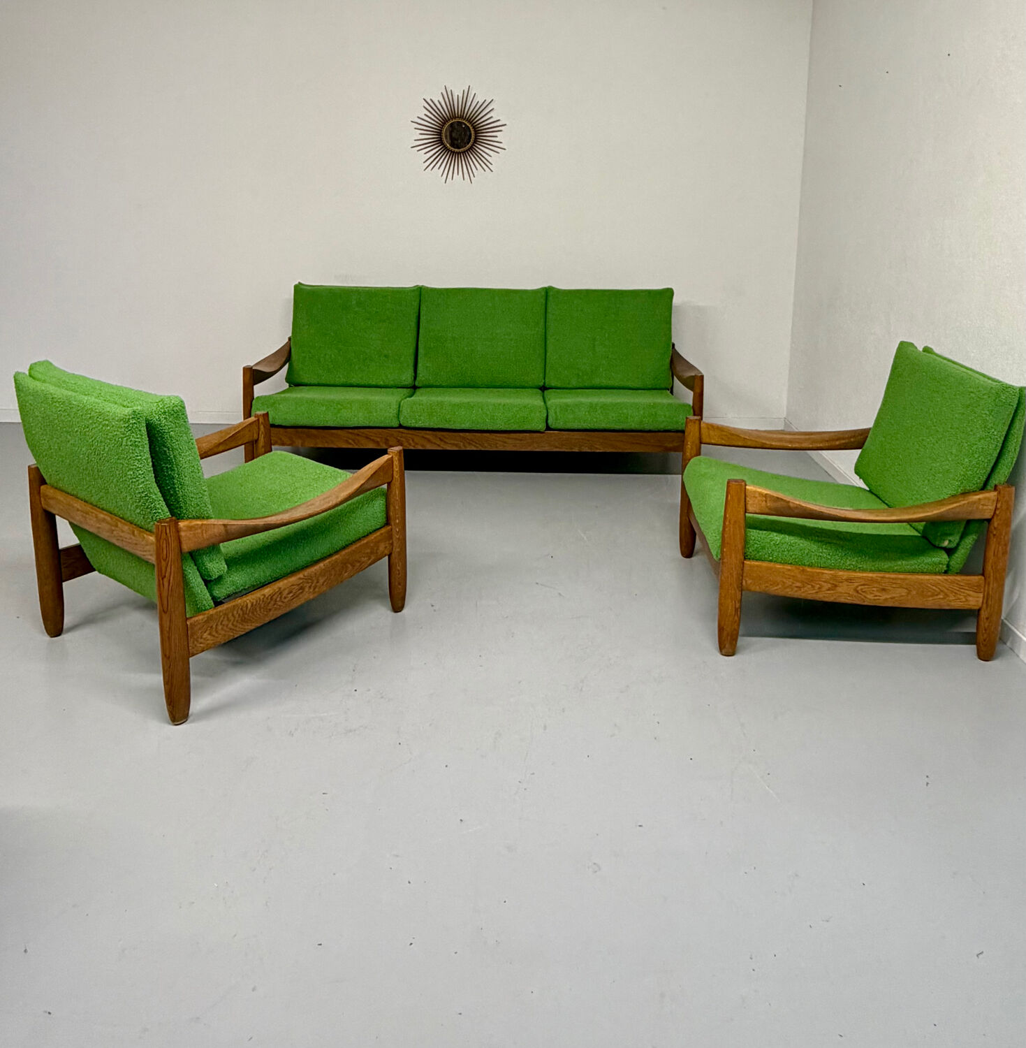 Living room sofa and Scandinavian design armchairs from the 1960s in green boucle.