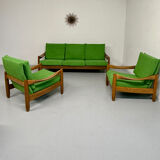 Living room sofa and Scandinavian design armchairs from the 1960s in green boucle.