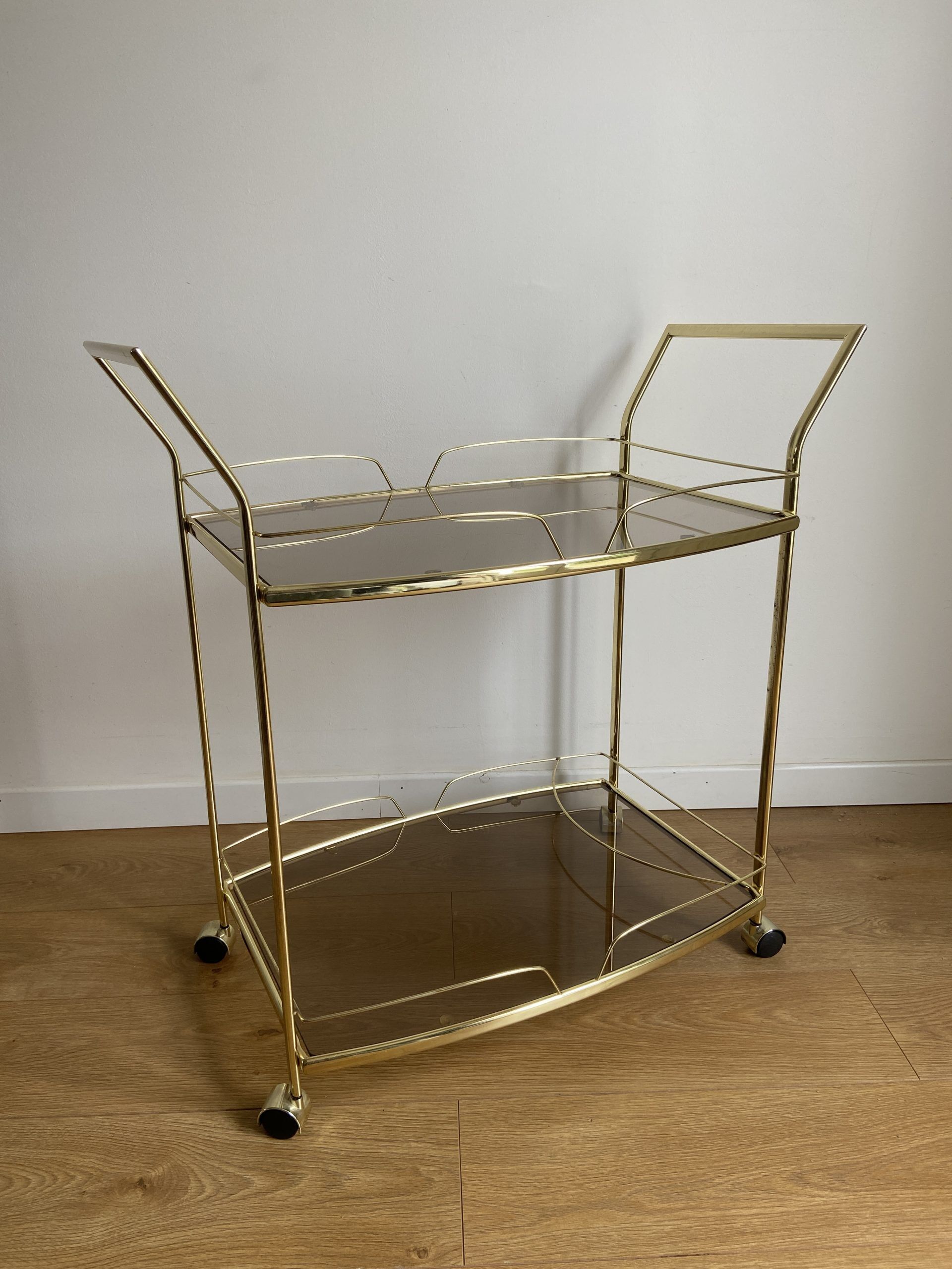 Vintage rolling service in gilded metal and smoked glass