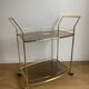 Vintage rolling service in gilded metal and smoked glass