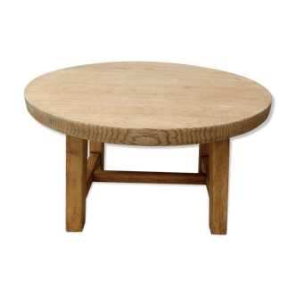 Round coffee table in raw wood