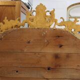 Large 19th-century wooden and gilt-studded mirror decorated with a cornucopia motif.