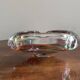 Clear with a soft coloured swirl pattern, round, glass ashtray