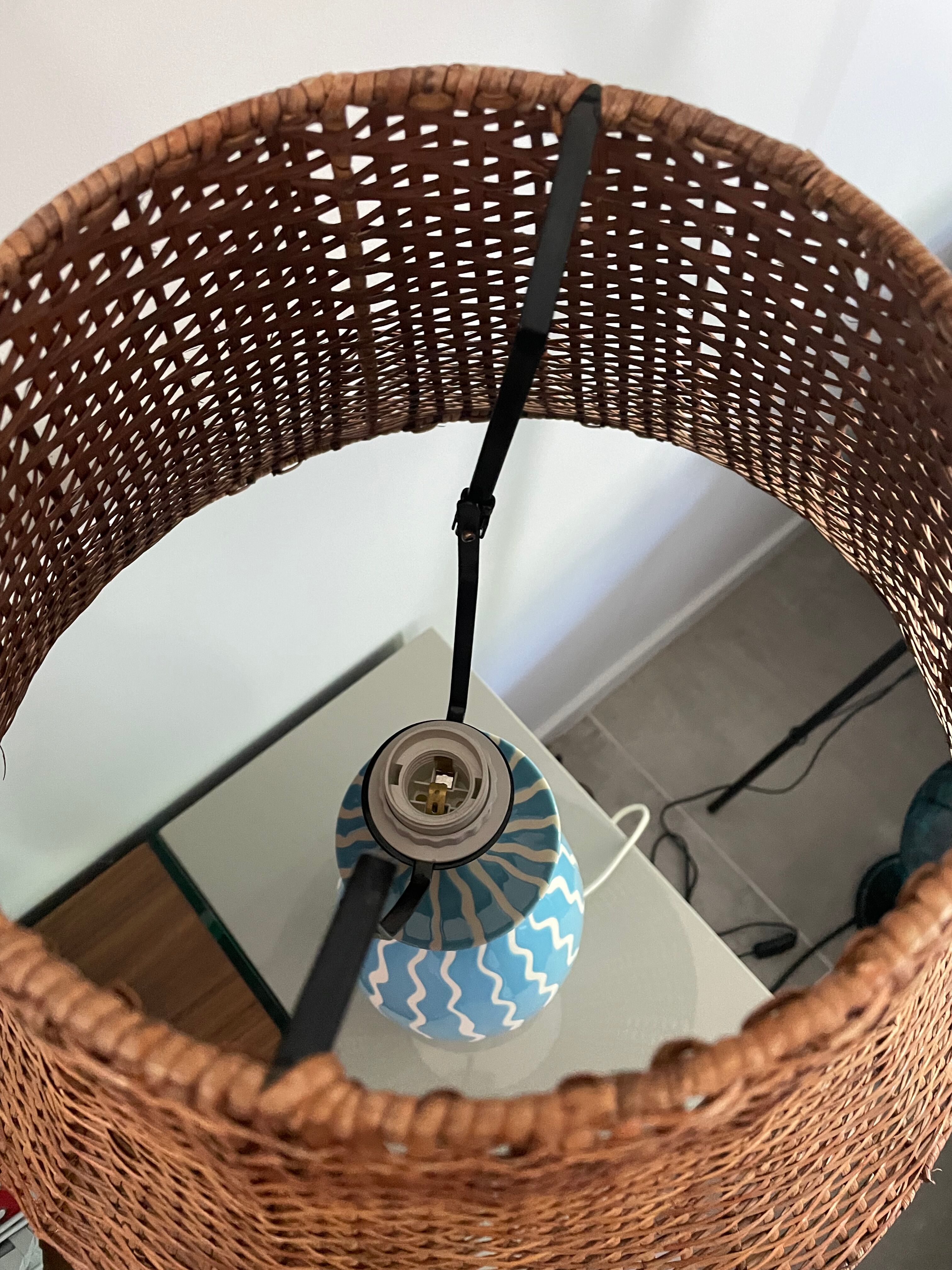 Blue ceramic lamp and rattan