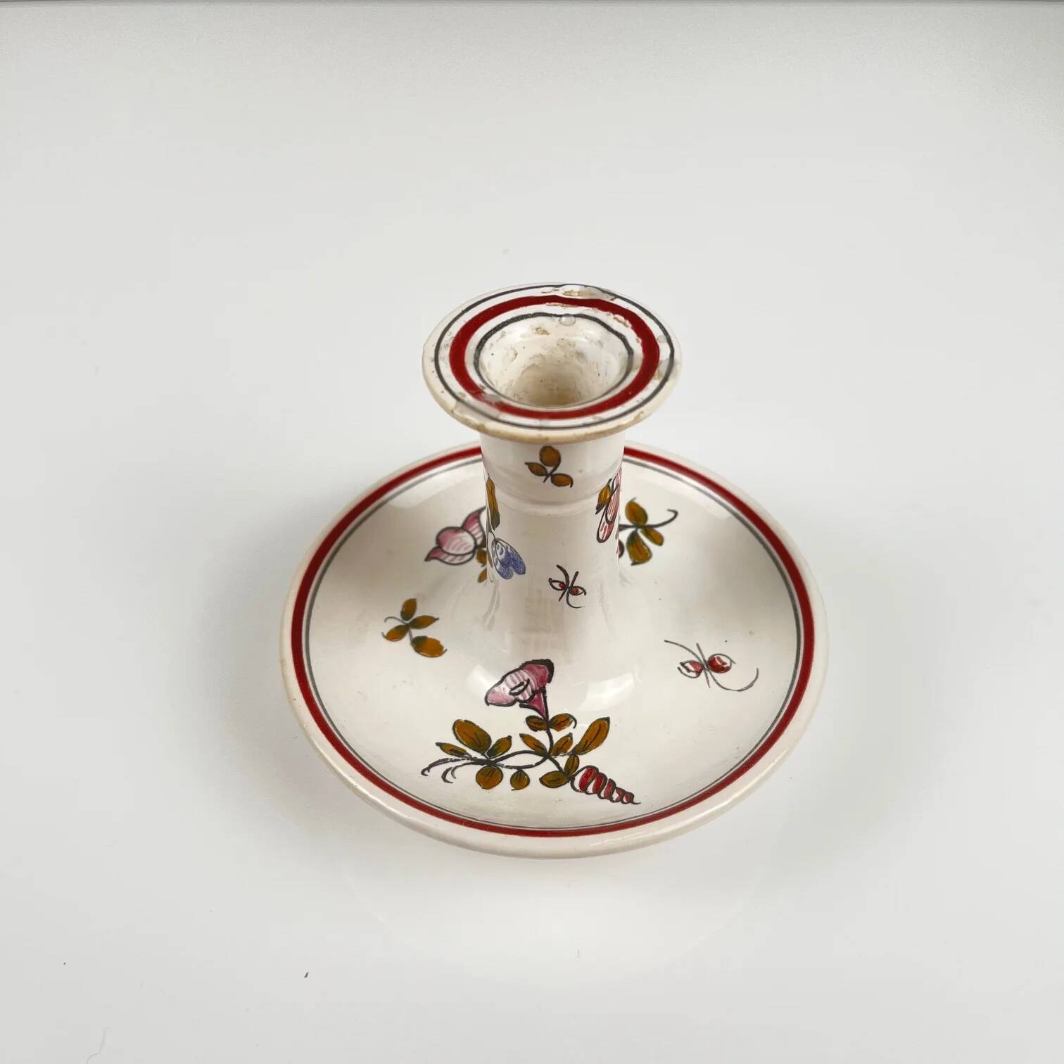 Hand-painted ceramic candlestick, flower pattern.