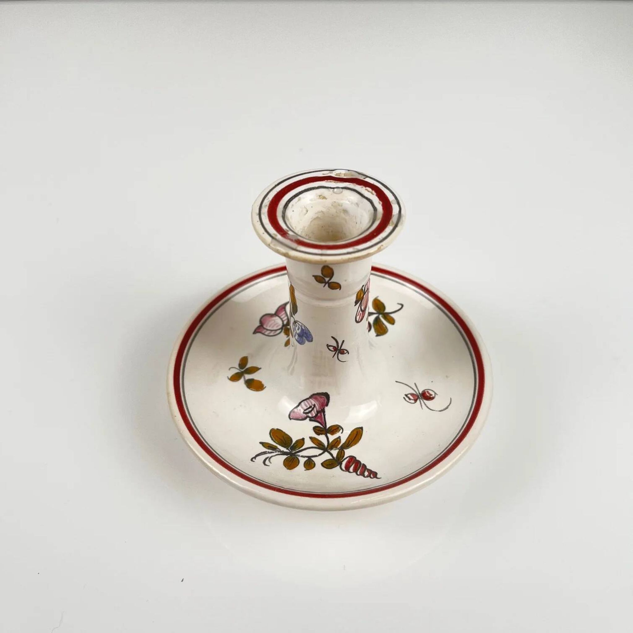 Hand-painted ceramic candlestick, flower pattern.