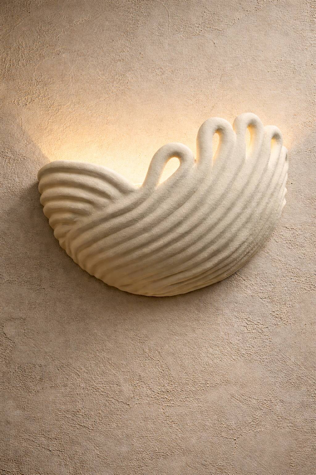 Draped ceramic wall light in a half-moon shape.
