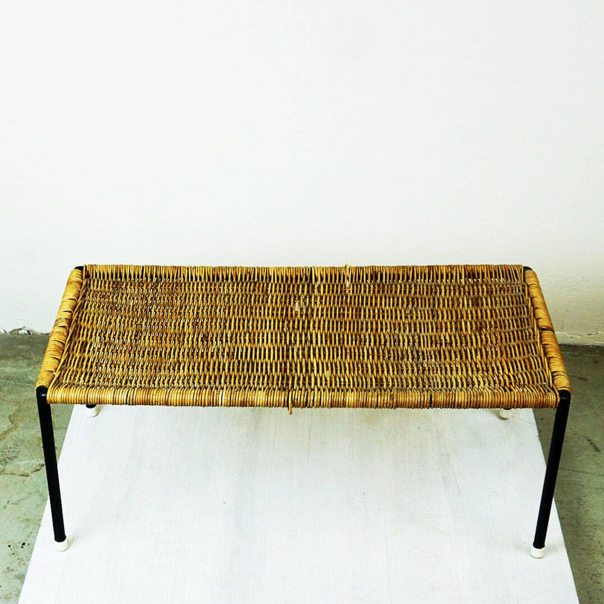 Black steel and wicker side table by Carl Auböck, mid-century.