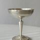 Silver-plated metal stand.