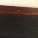 Rectangular wooden frame with slate black background