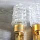 Pair of vintage wall sconces in gilded brass with moulded glass.