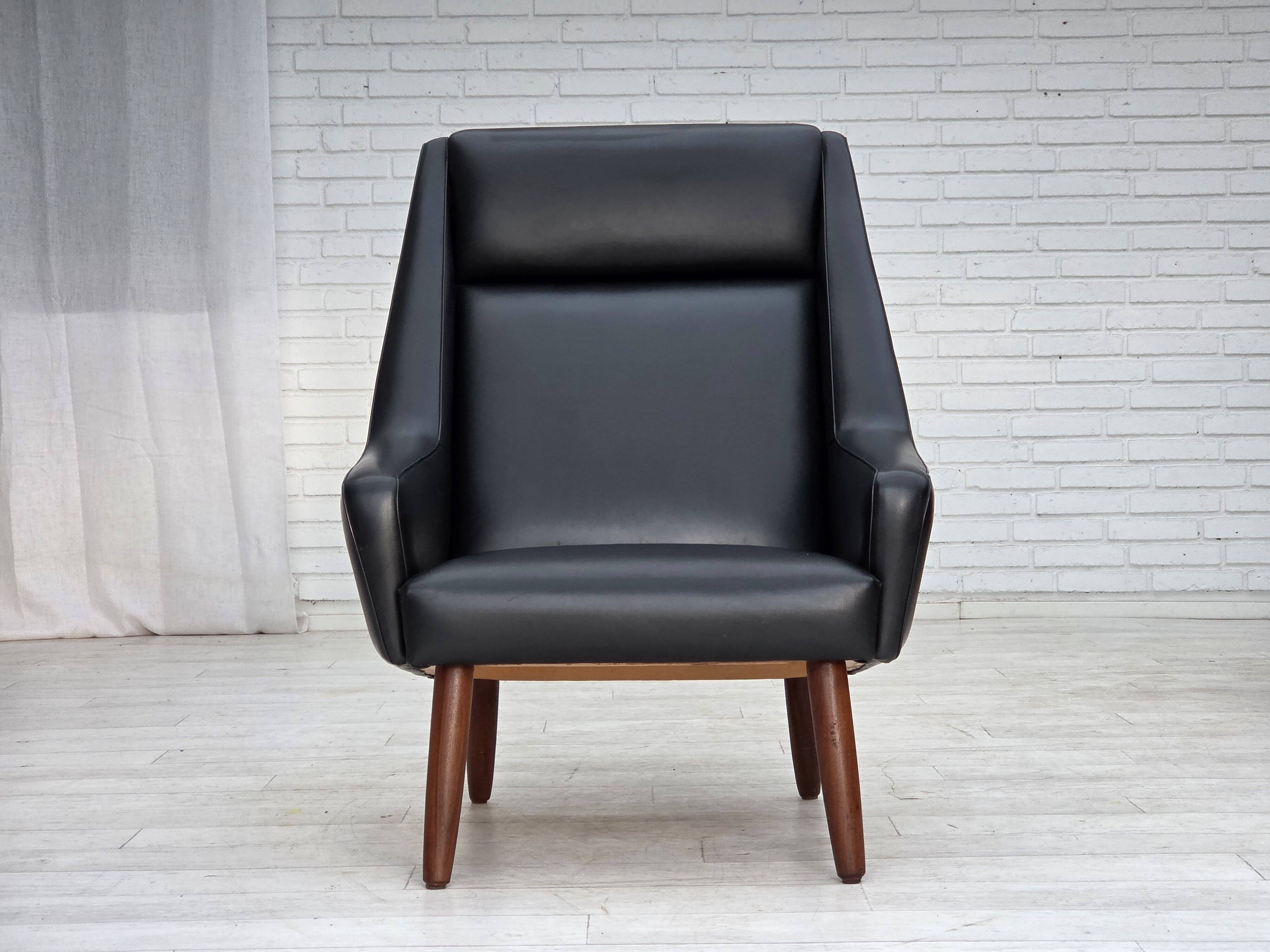 1970s, Danish highback armchair, black artificial leather, teak wood legs.