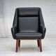 1970s, Danish highback armchair, black artificial leather, teak wood legs.