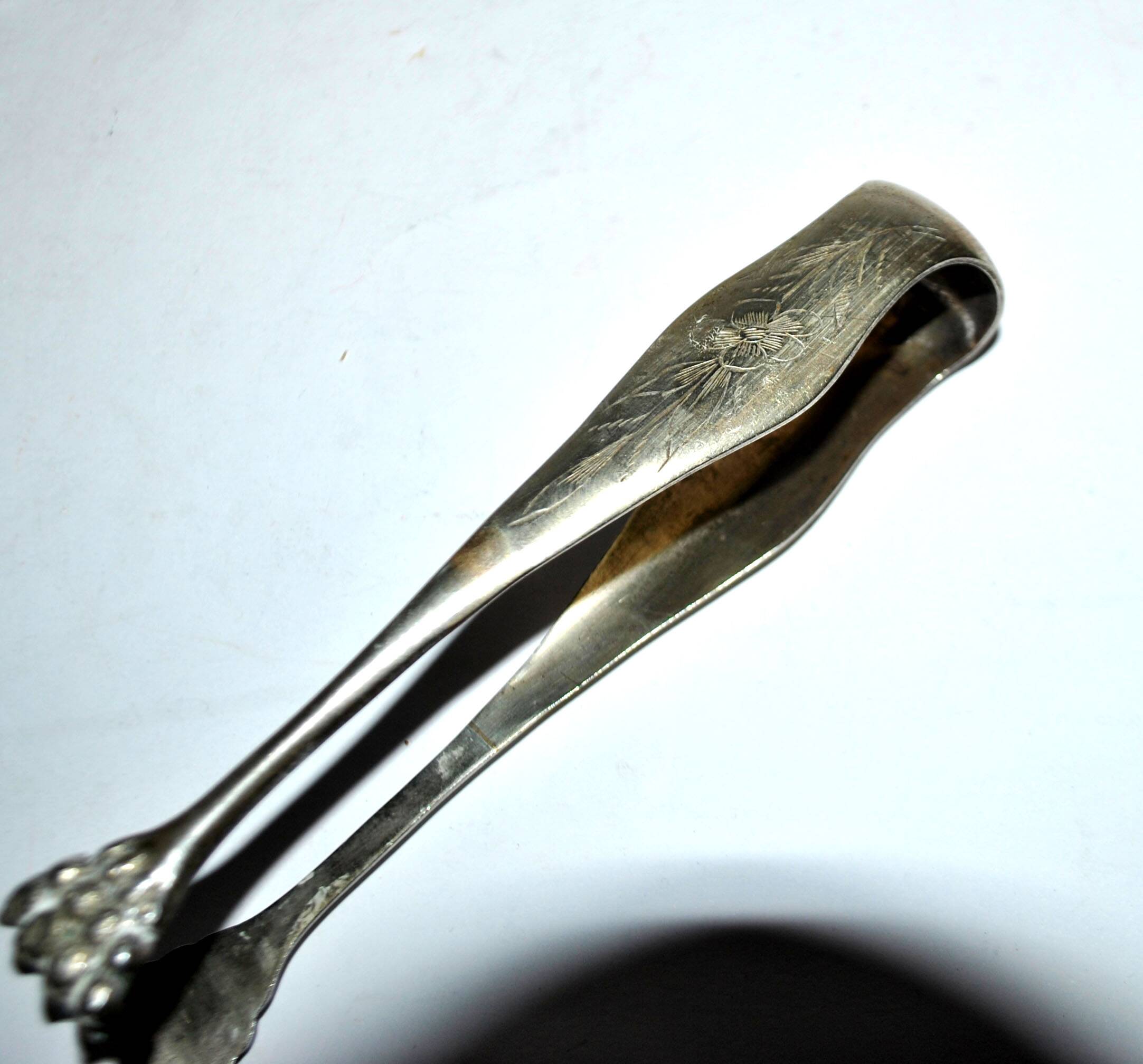 Vintage engraved silver metal lion claw sugar tongs