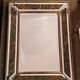 Beveled mirror decorated with flowers