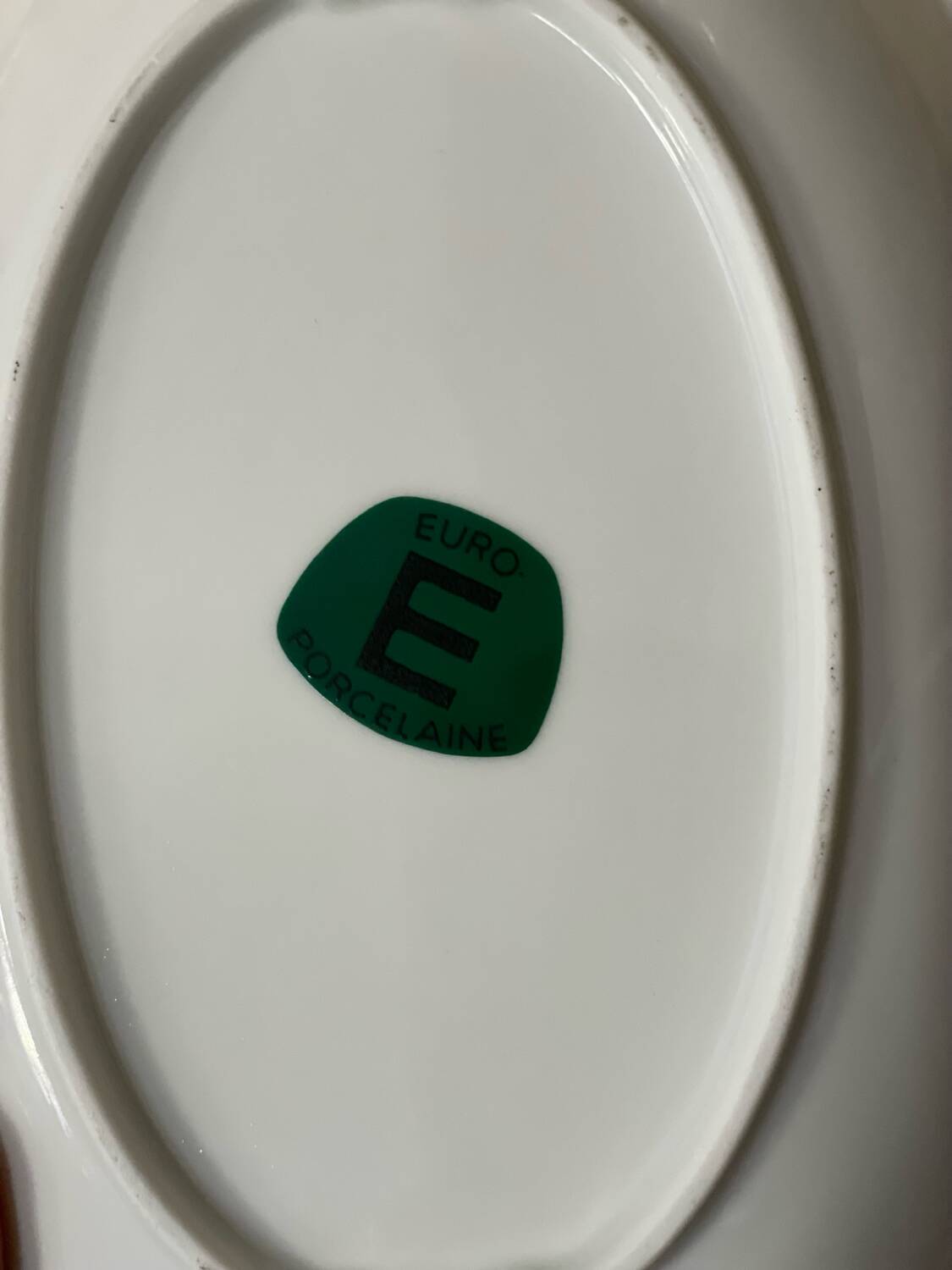 2 oval porcelain dishes with a floral pattern