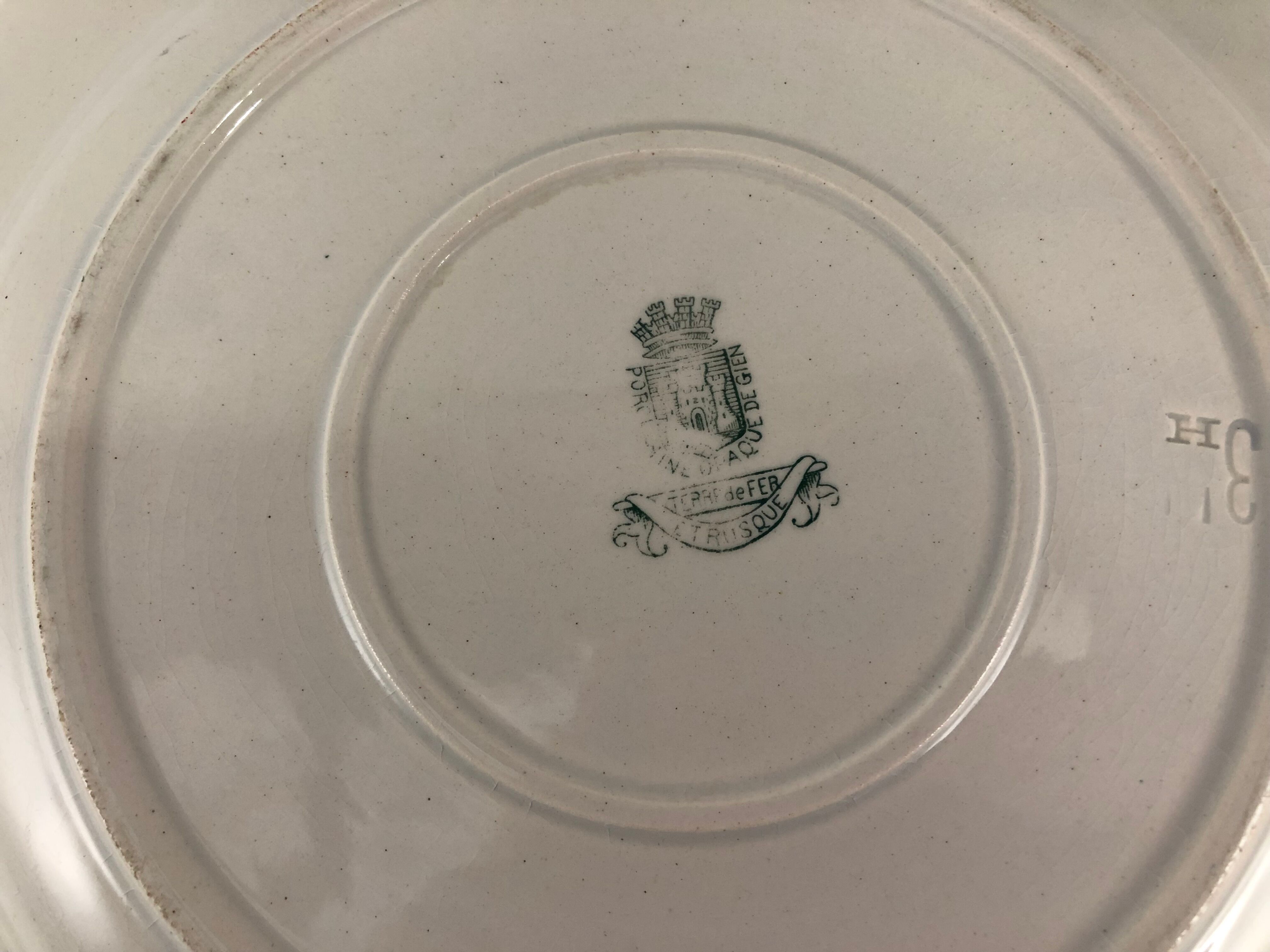 Old round serving dish Gien model Etruscan iron earth