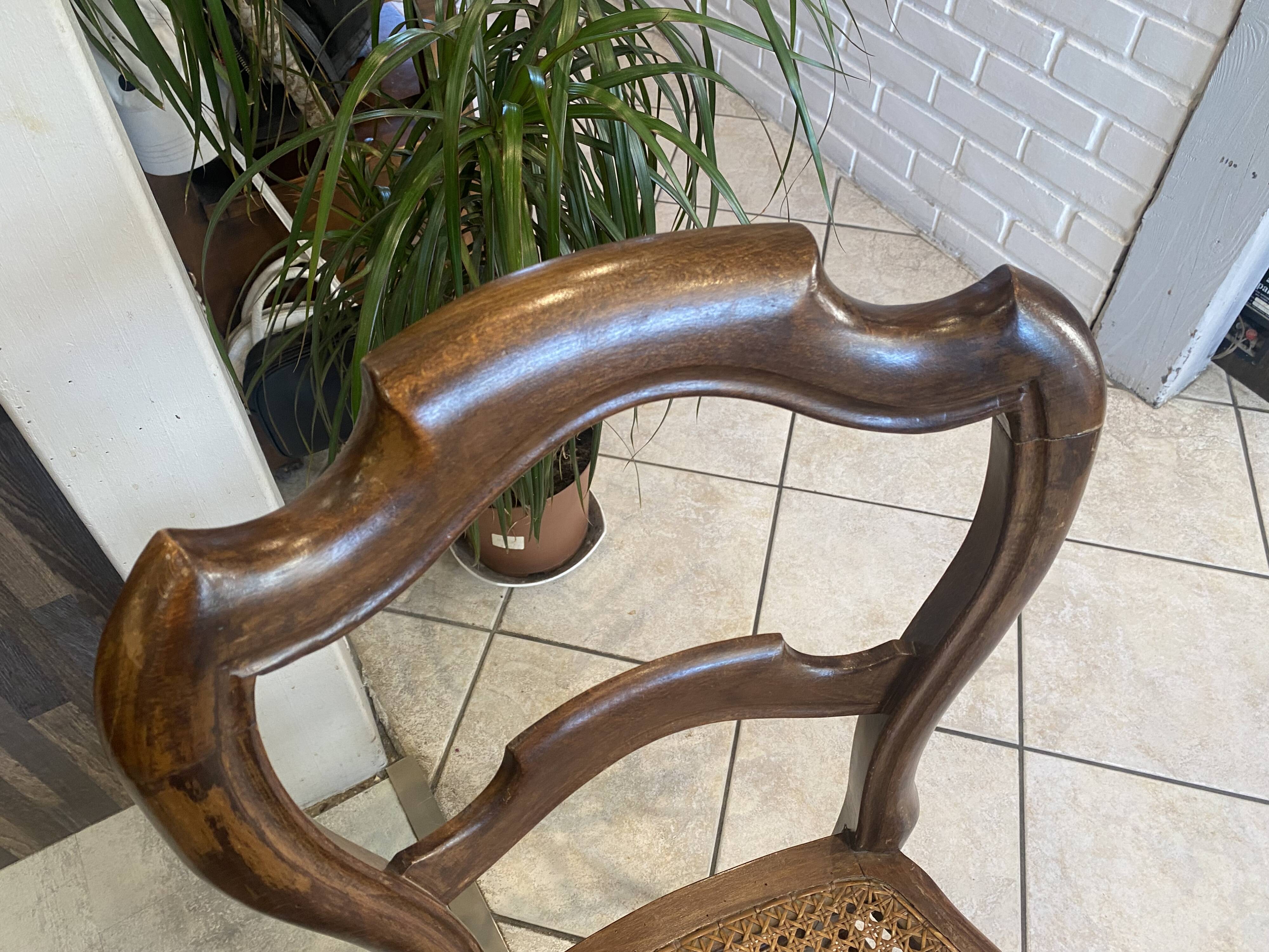 Pair of N2 antique caned and wooden chairs from the 1900s.