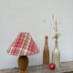 Wooden lamp and vintage red and green striped lampshade