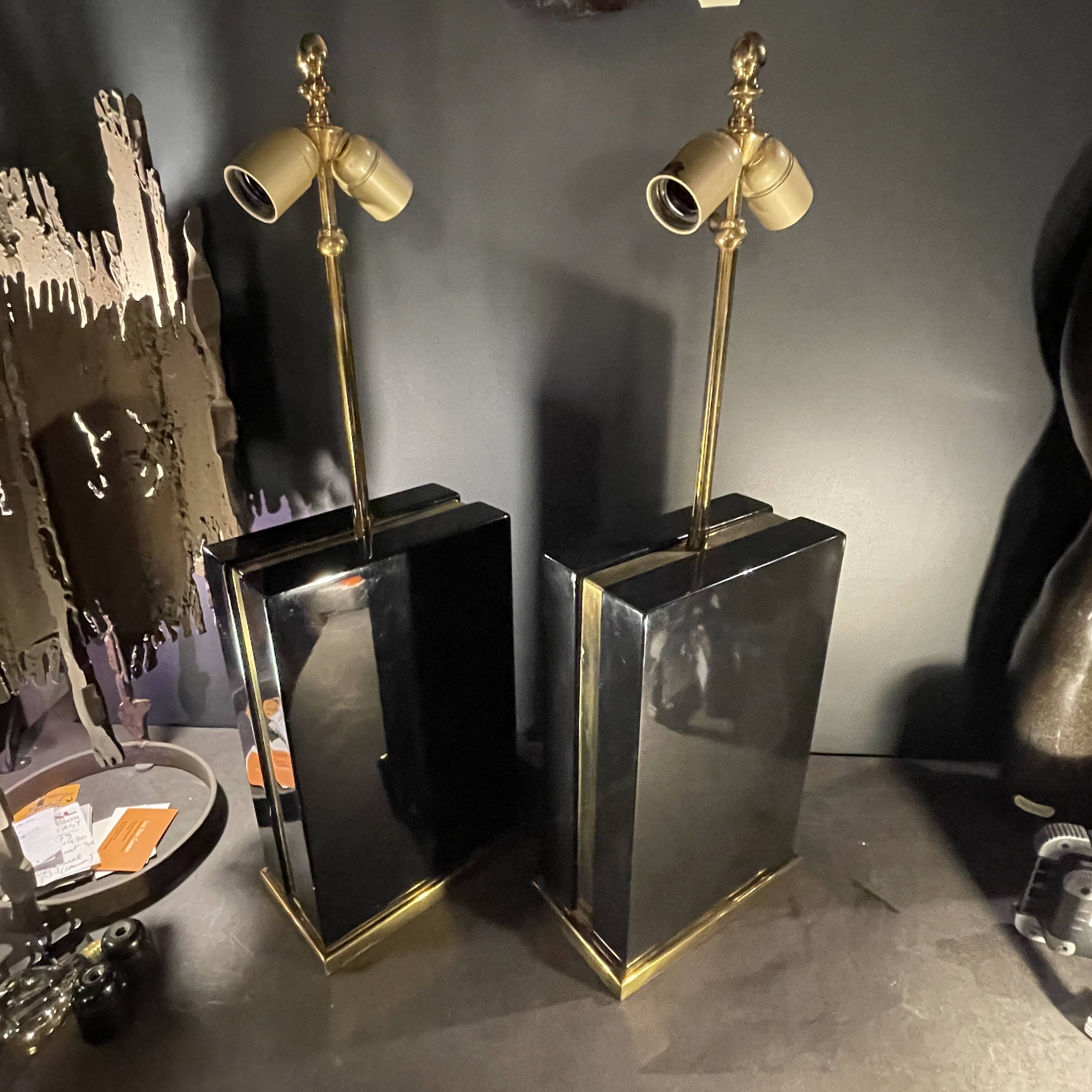 Pair of black lacquered and brass table lamps, circa 1970
