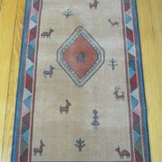 Pair of 60 x 120 Peruvian wool rugs