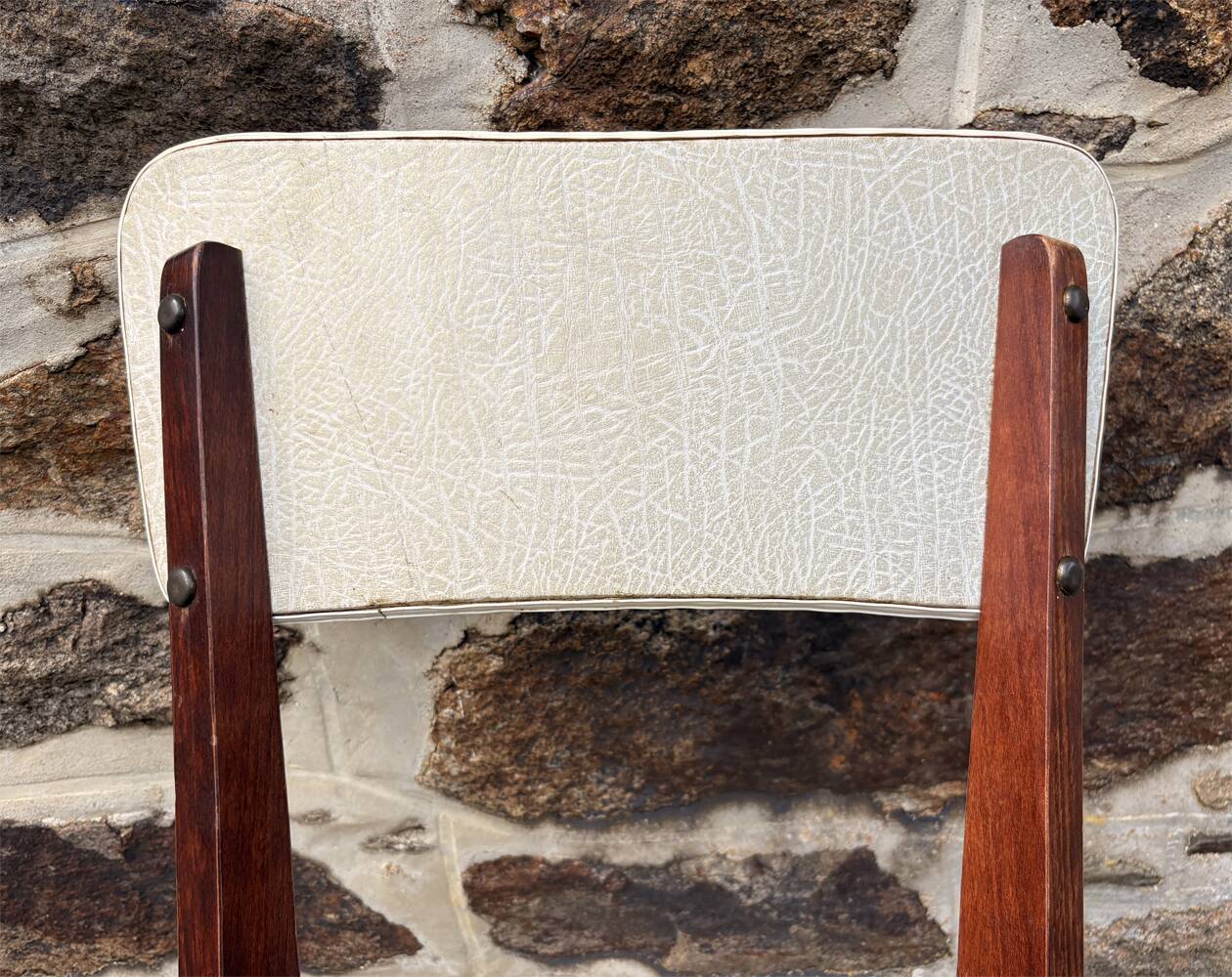 Pair of vintage chairs with upholstered backrest and seat, 1950s style.