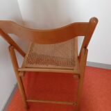 Folding chair in cannage
