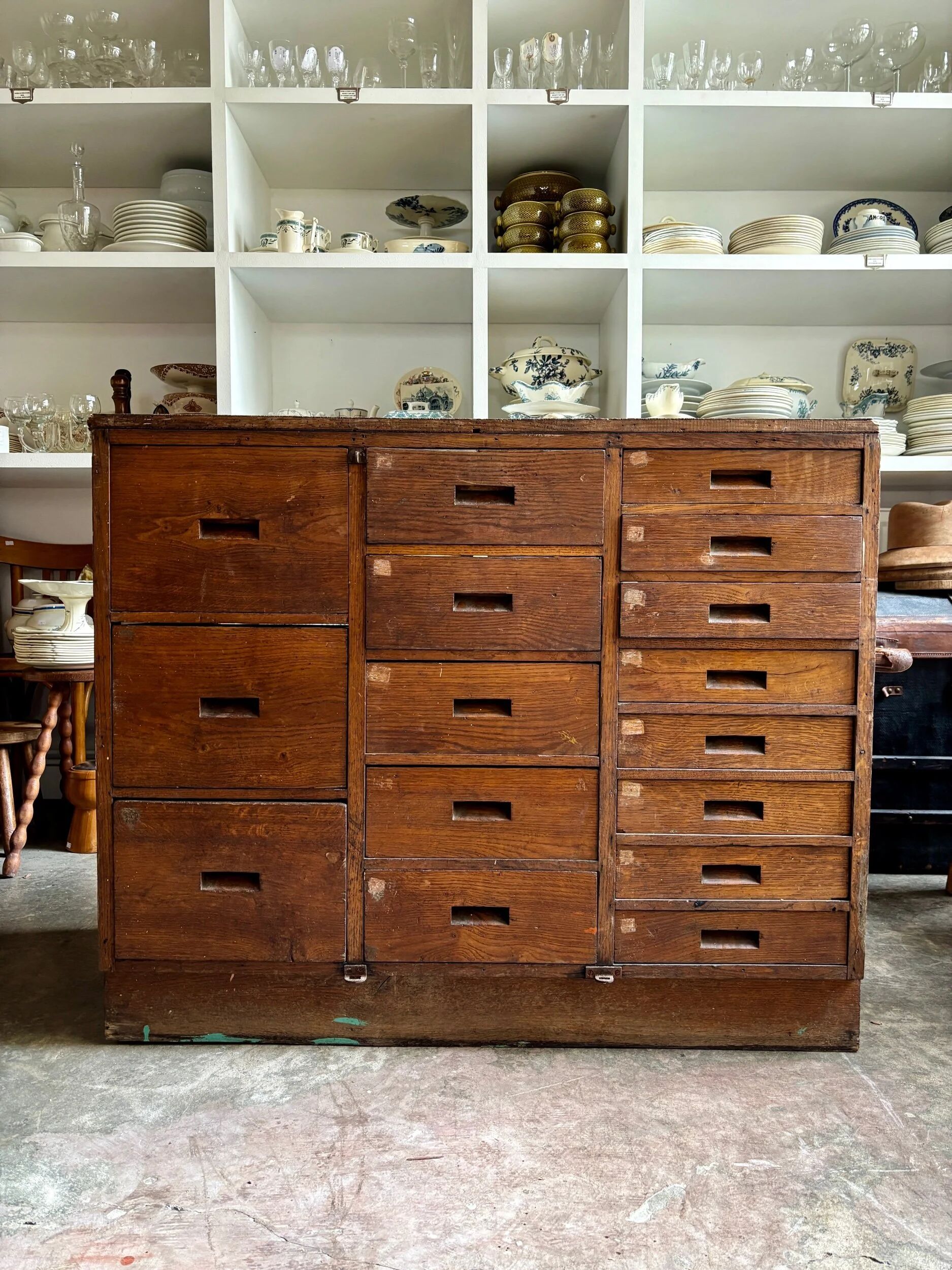 Craftsman's cabinet with 16 drawers in dark wood.