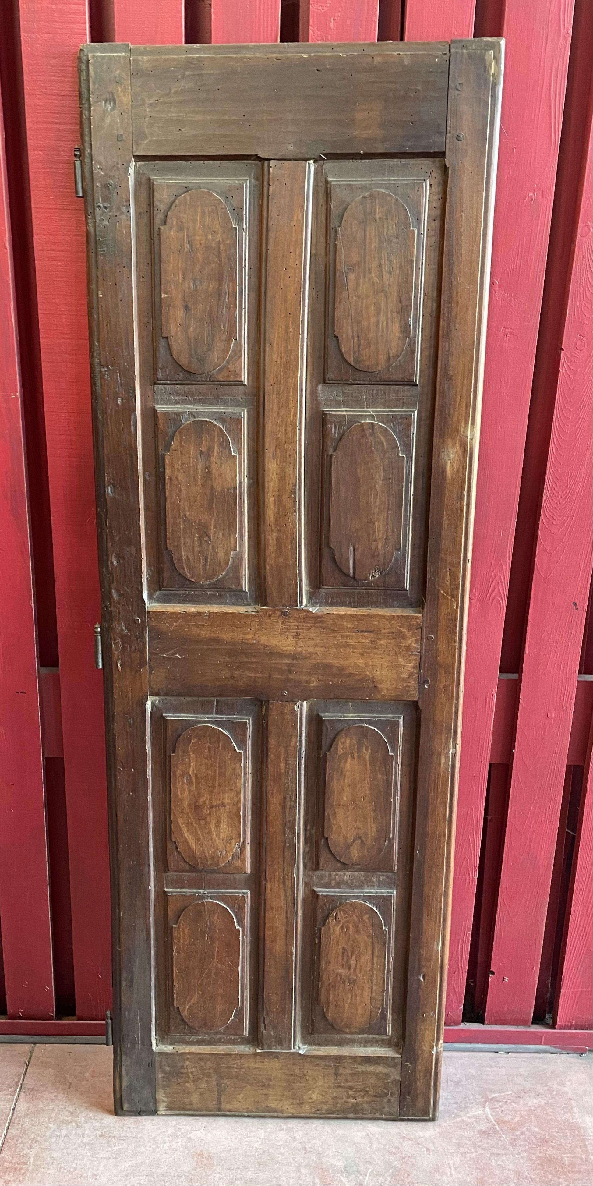 France old 18th century walnut closet door. Composed of 8 finely carved panels.