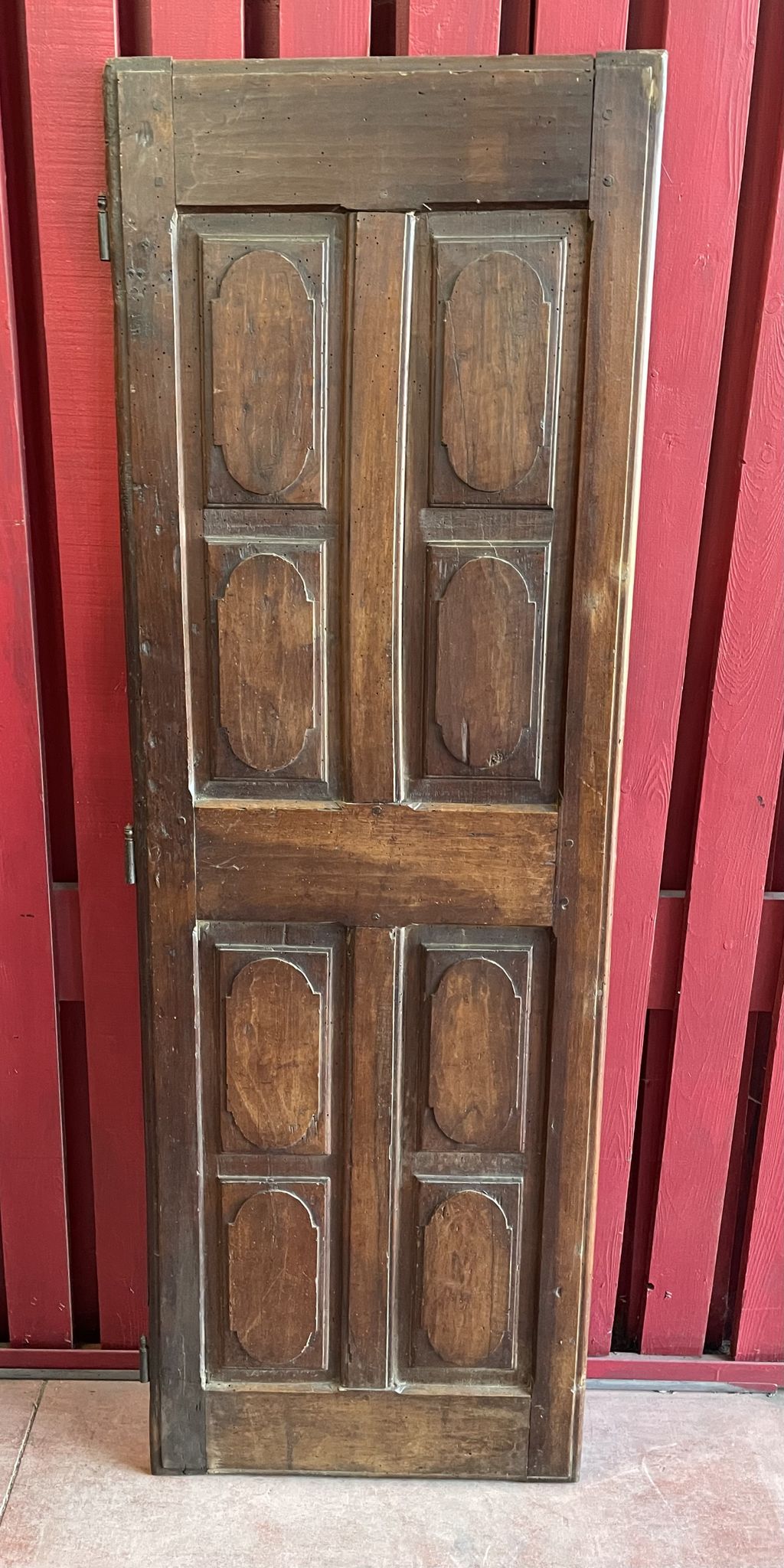 France old 18th century walnut closet door. Composed of 8 finely carved panels.