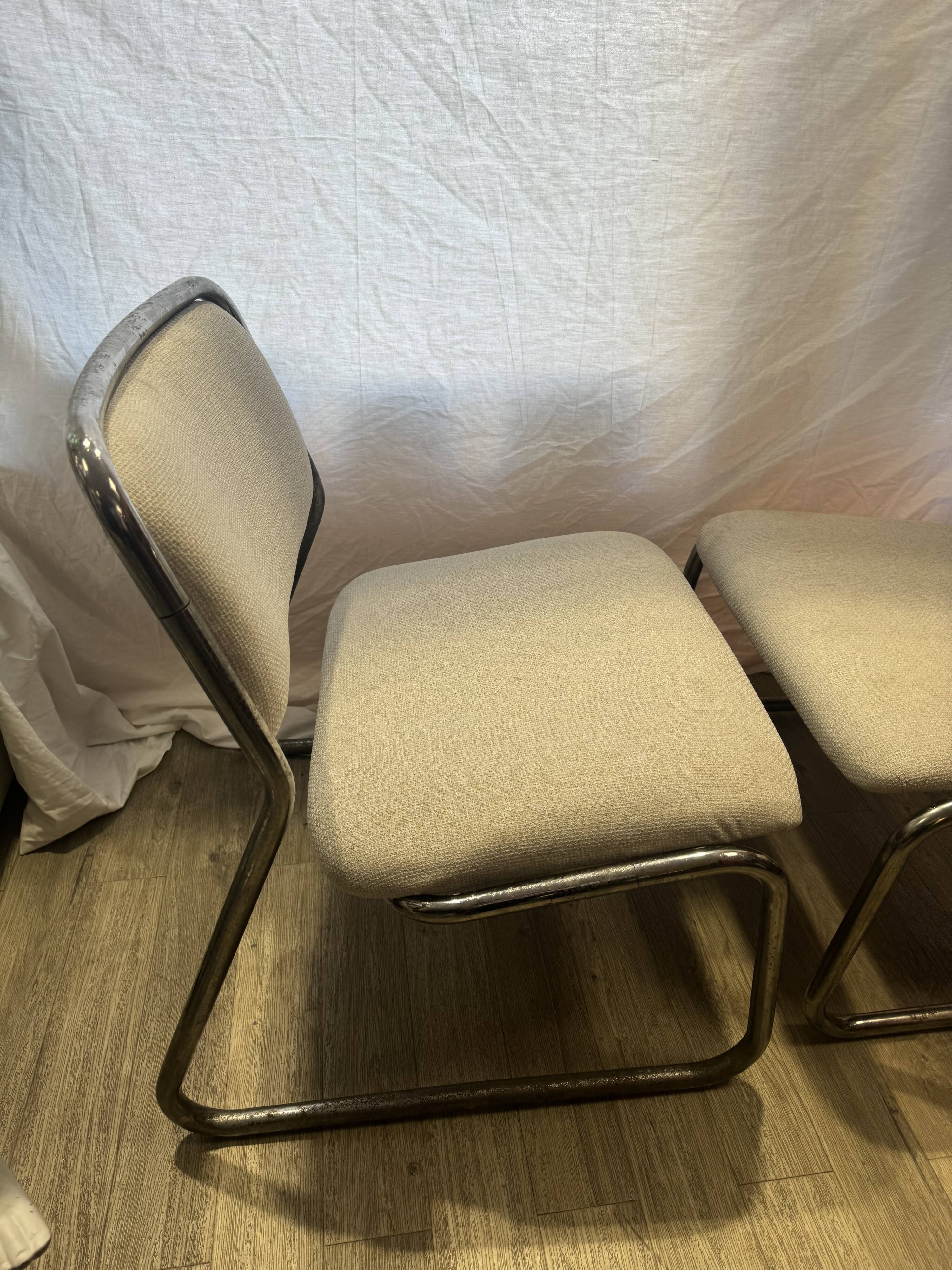 Pair of 70s tubular armchairs