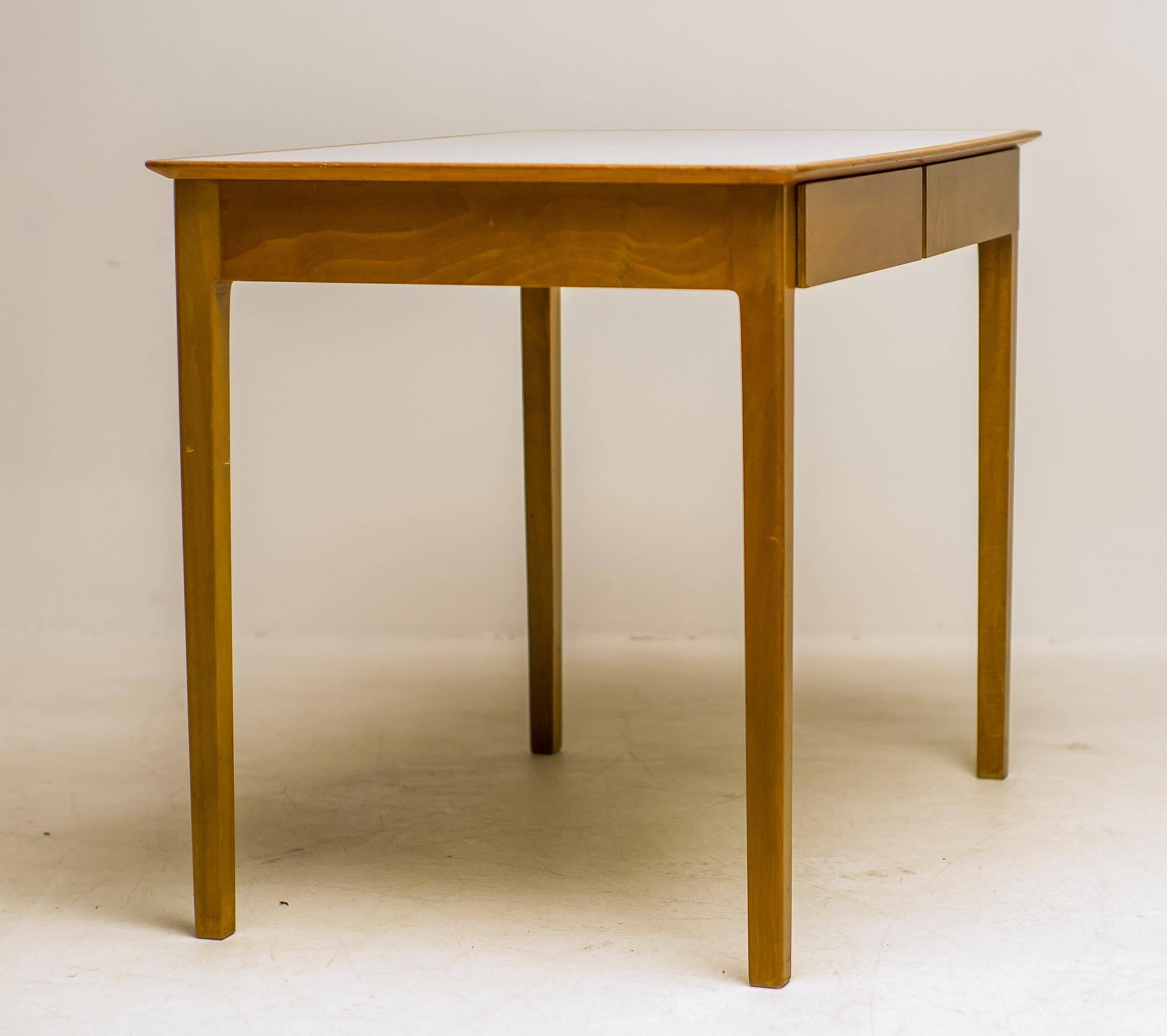 Small maple desk with a laminate top and two drawers, Fritz Hansen, 1950s.