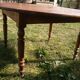 Round drop-leaf table in beech and pine