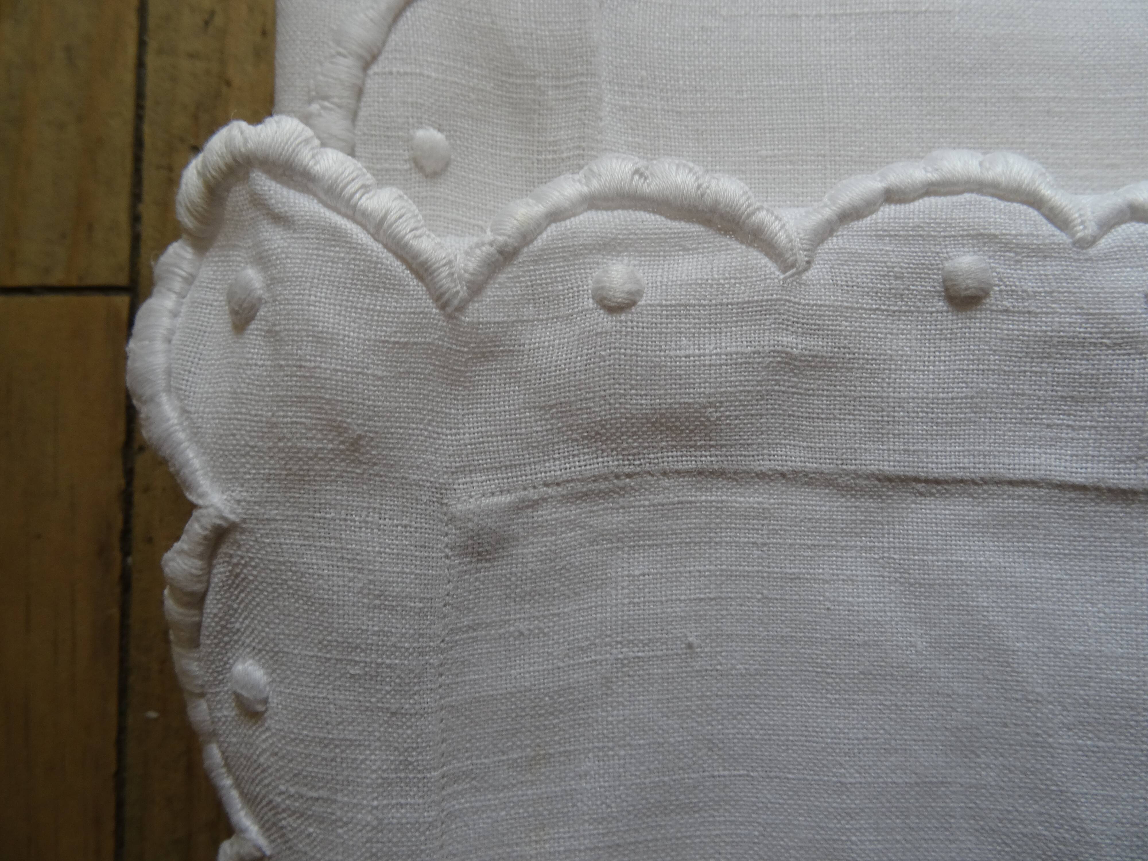 Pair of AL monogrammed pillowcases