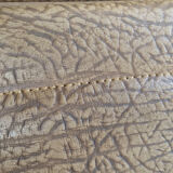 Pair of mustard skaï armchairs, brass feet