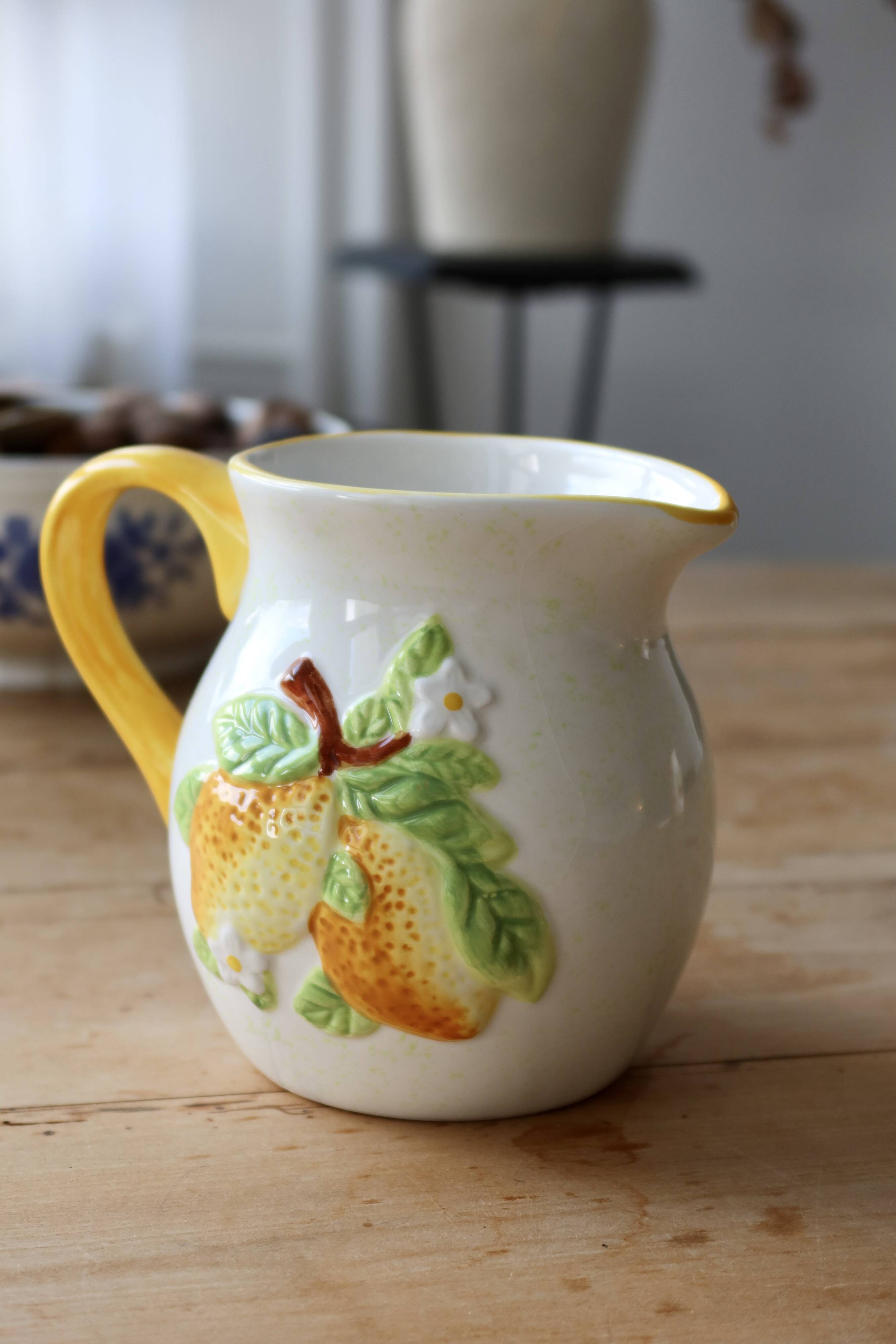 Vintage earthenware and slip pitcher with lemon motif