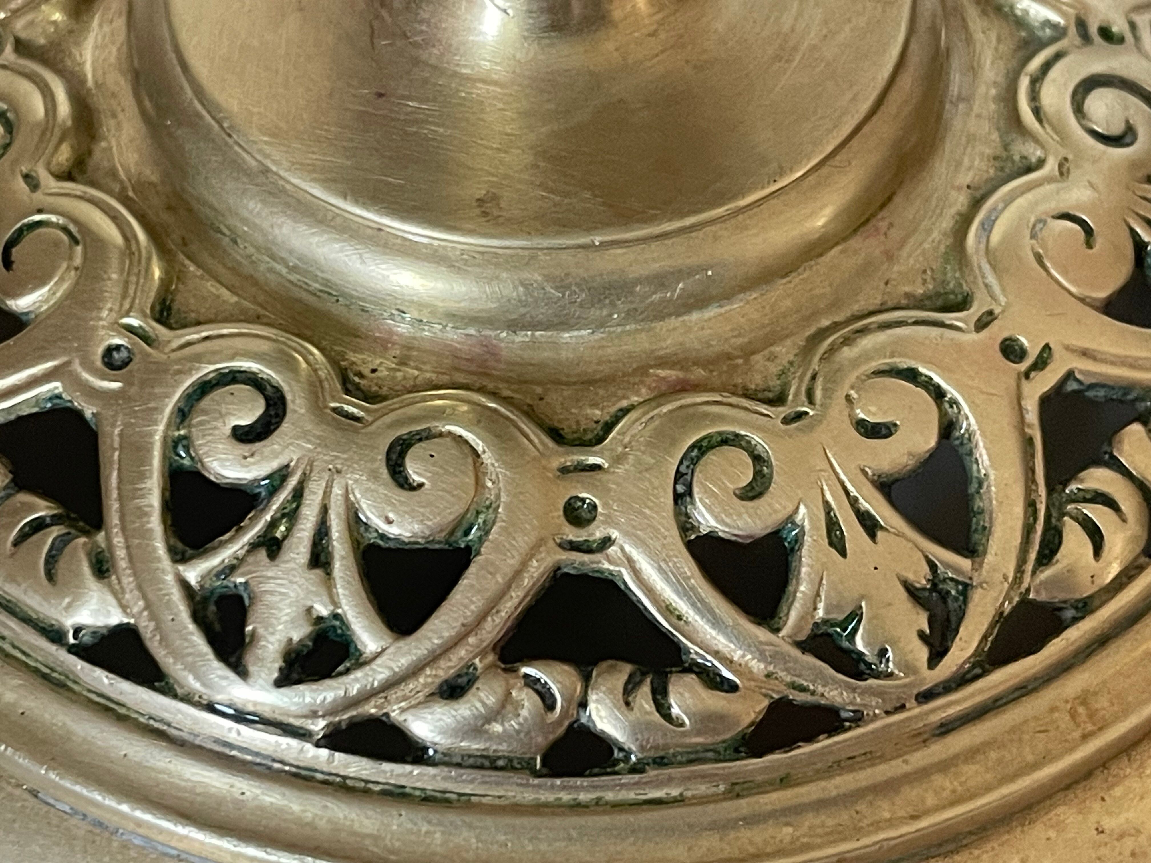 pair of openwork gilded brass candlesticks from the 19th century